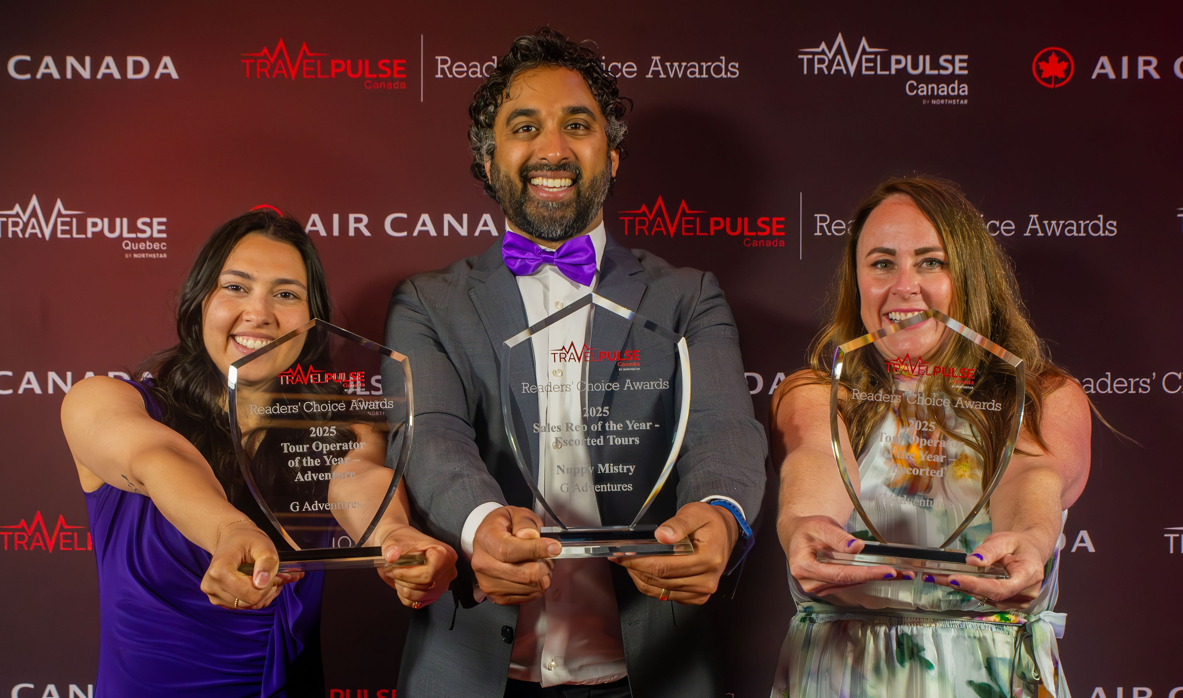 person in blue shirt writing on white paper